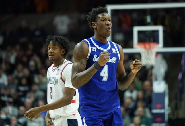 Feb 18, 2023; Storrs, Connecticut, USA; Seton Hall Pirates forward Tyrese Samuel (4) and UConn Huskies guard Tristen Newton (2) react after a play in the first half at Harry A. Gampel Pavilion. Mandatory Credit: David Butler II-USA TODAY Sports