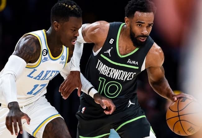 Mar 3, 2023; Los Angeles, California, USA; Minnesota Timberwolves guard Mike Conley (10) moves the ball against Los Angeles Lakers guard Dennis Schroder (17) during the second quarter at Crypto.com Arena. Mandatory Credit: Jonathan Hui-USA TODAY Sports