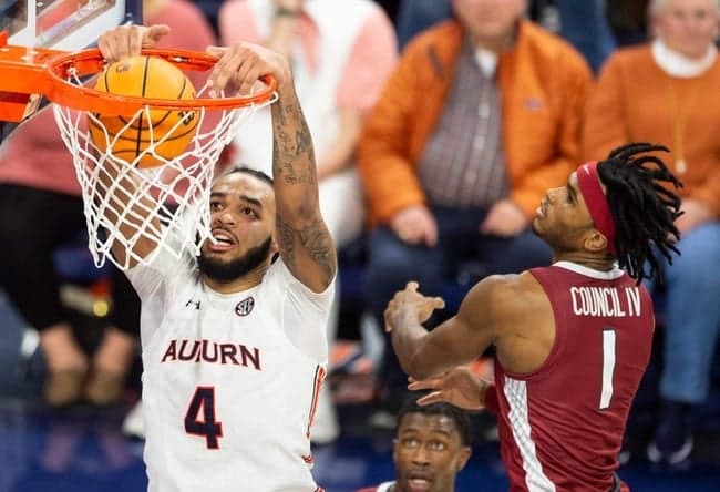 Auburn Tigers forward Johni Broome (4) dunks the ball as Auburn Tigers take on Arkansas Razorbacks at Neville Arena in Auburn, Ala., on Saturday, Jan. 7, 2023. Auburn Tigers defeated Arkansas Razorbacks 72-59.