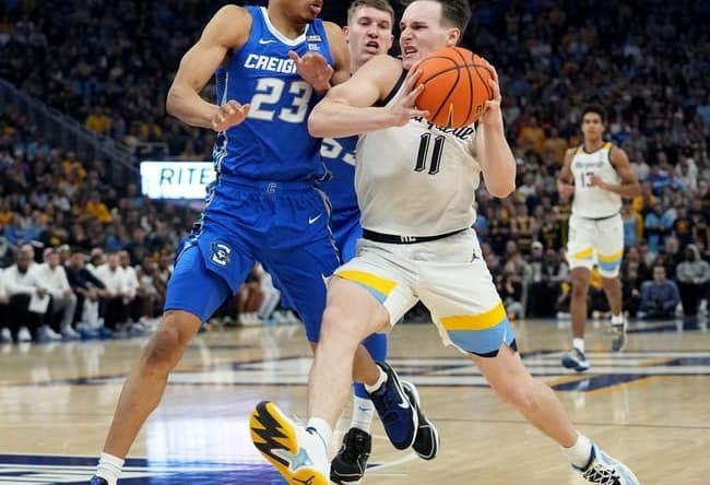 Marquette guard Tyler Kolek drives past Creighton guard Trey Alexander during the first half at Fiserv Forum.Mark Hoffman/Milwaukee Journal Sentinel