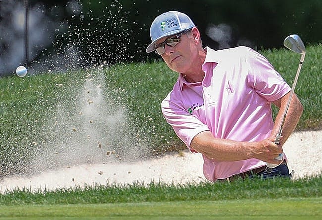 Justin Leonard chips from the number 16 bunker during first round of the Bridgestone Senior Players Championship on Thursday, July 7, 2022 in Akron, Ohio, at Firestone Country Club.

Syndication Akron Beacon Journal