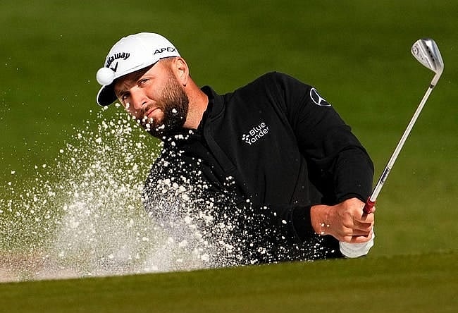 Jon Rahm makes an eagle-3 from a green side bunker on the 15th hole during round two of the WM Phoenix Open at TPC Scottsdale on Feb 10, 2023.