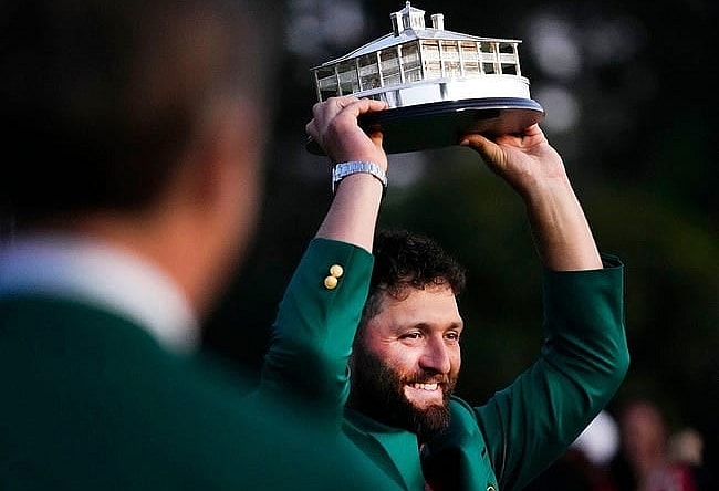 Apr 9, 2023; Augusta, Georgia, USA; Masters champion Jon Rahm holds up the trophy after the final round of The Masters golf tournament.