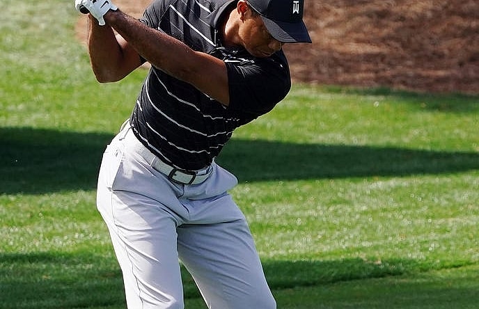 Apr 2, 2023; Augusta, Georgia, USA; Tiger Woods warms up on the practice range in preparation for the Masters Tournament at Augusta National Golf Club. Mandatory Credit: Katie Goodale-USA TODAY Sports