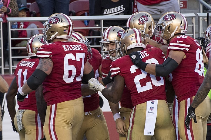 49ers players celebrate with C.J. Beathard in NFL Week 10