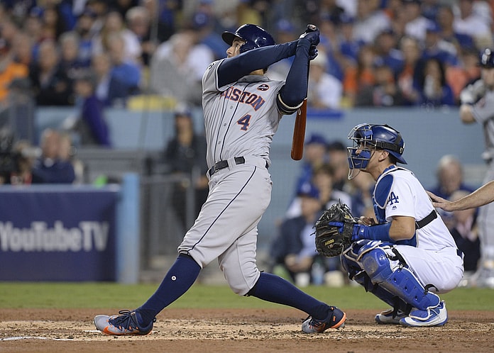 Houston Astros center fielder George Springer hits a solo home run against the Los Angeles Dodgers in the third inning in game six of the 2017 World Series at Dodger Stadium.