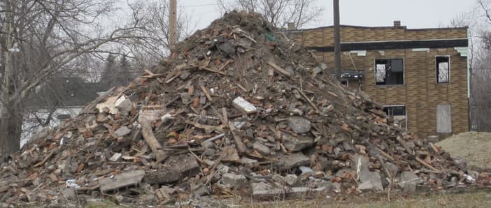 A neighborhood in Detroit overrun by debris and abandoned by citizens. 