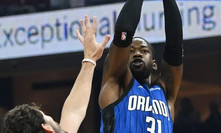 Oct 26, 2022; Cleveland, Ohio, USA; Orlando Magic guard Terrence Ross (31) shoots over the defense of Cleveland Cavaliers forward Cedi Osman (16) during the first half at Rocket Mortgage FieldHouse. Mandatory Credit: Ken Blaze-USA TODAY Sports