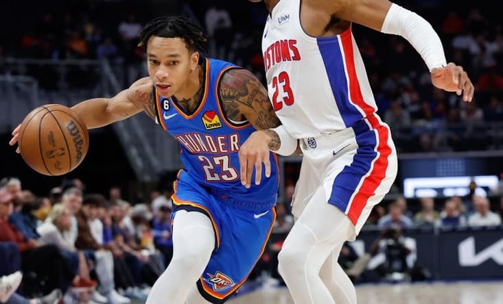 Oct 11, 2022; Detroit, Michigan, USA; Oklahoma City Thunder guard Tre Mann (23) dribbles defended by Detroit Pistons guard Jaden Ivey (23) in the first half at Little Caesars Arena. Mandatory Credit: Rick Osentoski-USA TODAY Sports
