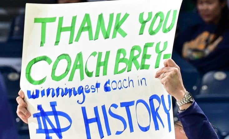 Feb 11, 2023; South Bend, Indiana, USA; A fan holds a sign thanking Notre Dame Fighting Irish head coach Mike Brey during the game against the Virginia Tech Hokies at the Purcell Pavilion. Brey announced he is stepping down from coaching at Notre Dame at the end of the season. Mandatory Credit: Matt Cashore-USA TODAY Sports