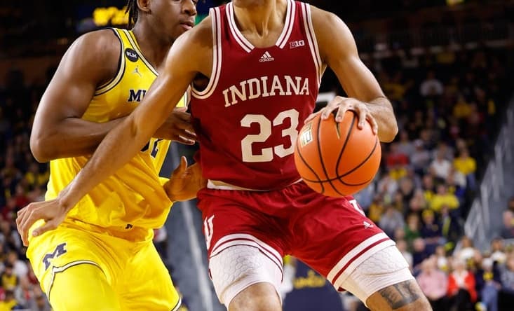 Feb 11, 2023; Ann Arbor, Michigan, USA; Indiana Hoosiers forward Trayce Jackson-Davis (23) dribbles on Michigan Wolverines forward Tarris Reed Jr. (32) in the second half at Crisler Center. Mandatory Credit: Rick Osentoski-USA TODAY Sports