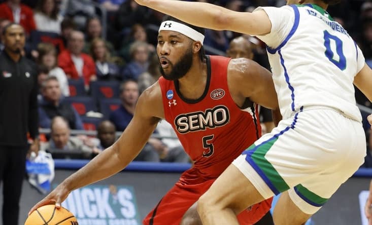 Mar 14, 2023; Dayton, OH, USA; Southeast Missouri State Redhawks guard Chris Harris (5) looks to play the ball defended by Texas A&M-CC Islanders guard Trevian Tennyson (0) in the second half at UD Arena. Mandatory Credit: Rick Osentoski-USA TODAY Sports
