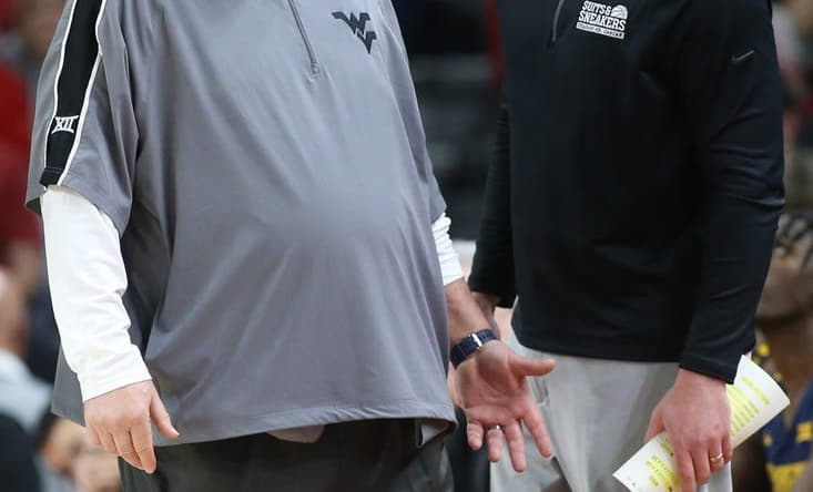 Jan 29, 2022; Fayetteville, Arkansas, USA; West Virginia Mountaineers head coach Bob Huggins and director of basketball operations Josh Eilert during the game against the Arkansas Razorbacks at Bud Walton Arena. Arkansas won 77-68. Mandatory Credit: Nelson Chenault-USA TODAY Sports