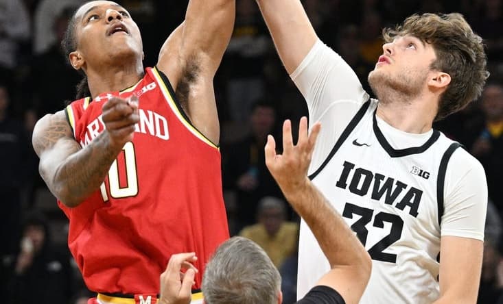 Jan 24, 2024; Iowa City, Iowa, USA; Iowa Hawkeyes forward Owen Freeman (32) and Maryland Terrapins forward Julian Reese (10) battle for the opening tipoff during the first half at Carver-Hawkeye Arena. Mandatory Credit: Jeffrey Becker-USA TODAY Sports