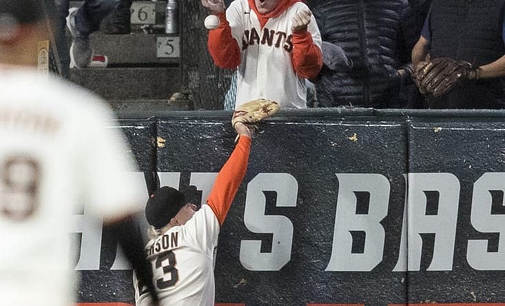Jul 28, 2022; San Francisco, California, USA; San Francisco Giants left fielder Joc Pederson (23) misses a deep fly ball to allow Chicago Cubs third baseman Patrick Wisdom (16) a two-run home run during the seventh inning at Oracle Park. Mandatory Credit: John Hefti-USA TODAY Sports