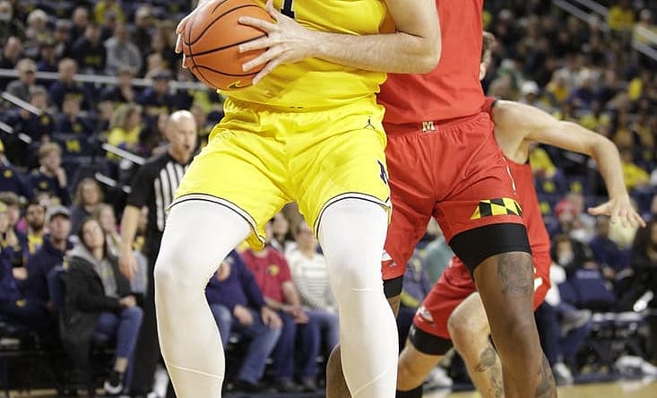 Jan 1, 2023; Ann Arbor, Michigan, USA; Michigan Wolverines center Hunter Dickinson (1) handles the ball against Maryland Terrapins forward Julian Reese (10) during the first half at Crisler Center. Mandatory Credit: Brian Bradshaw Sevald-USA TODAY Sports