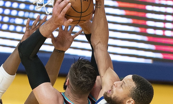 May 16, 2021; San Francisco, California, USA; Golden State Warriors guard Stephen Curry (30) blocks the shot attempt by Memphis Grizzlies center Jonas Valanciunas (17) during the first quarter at Chase Center. Mandatory Credit: Kyle Terada-USA TODAY Sports