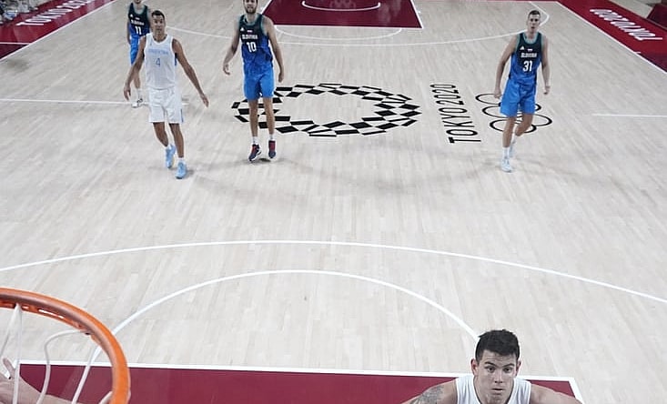 Jul 26, 2021; Saitama, Japan; Slovenia player Luka Doncic (77) and Argentina player Luca Vildoza (17) battle for a rebound during the Tokyo 2020 Olympic Summer Games at Saitama Super Arena. Mandatory Credit: Kyle Terada-USA TODAY Sports