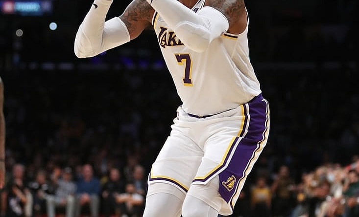 Oct 24, 2021; Los Angeles, California, USA; Los Angeles Lakers forward Carmelo Anthony (7) shoots a three-pointer during the third quarter to move into 9th place on the All-Time Scoring List during the game against the Memphis Grizzlies at Staples Center. The Lakers won 121-118. Mandatory Credit: Kiyoshi Mio-USA TODAY Sports