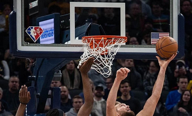 Nov 26, 2021; Indianapolis, Indiana, USA; Indiana Pacers forward Domantas Sabonis (11) shoots the ball while Toronto Raptors forward Precious Achiuwa (5) defends in the first quarter at Gainbridge Fieldhouse. Mandatory Credit: Trevor Ruszkowski-USA TODAY Sports