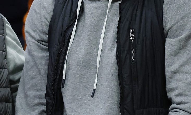 Jan 18, 2023; Charlottesville, Virginia, USA; Former NFL quarterback and Virginia Tech Hokies player Michael Vick watches from courtside during the Hokies' game against the Virginia Cavaliers in the second half at John Paul Jones Arena. Mandatory Credit: Geoff Burke-USA TODAY Sports