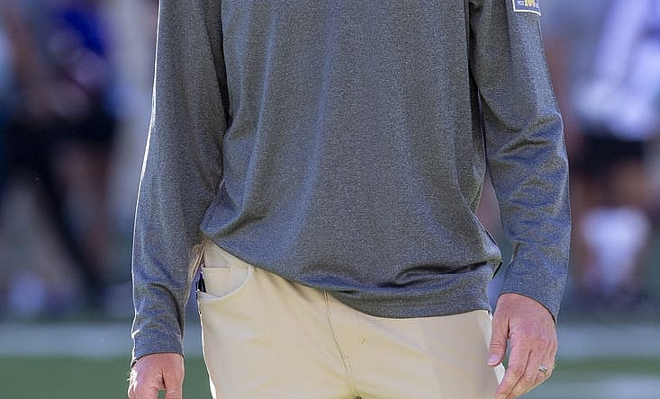 Sep 3, 2022; Manhattan, Kansas, USA; Kansas State Wildcats offensive coordinator Collin Klein watches the team warm up before the start of a game against the South Dakota Coyotes at Bill Snyder Family Football Stadium. Mandatory Credit: Scott Sewell-USA TODAY Sports