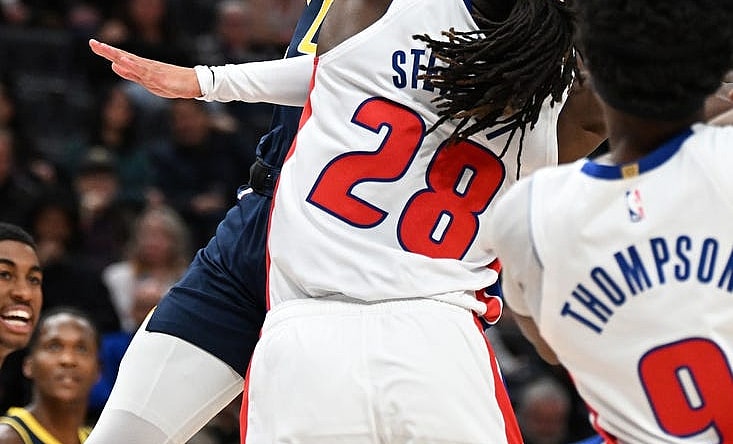 Dec 11, 2023; Detroit, Michigan, USA;  Indiana Pacers guard Tyrese Haliburton (0) shoots over Detroit Pistons center Isaiah Stewart (28) in the first quarter at Little Caesars Arena. Mandatory Credit: Lon Horwedel-USA TODAY Sports