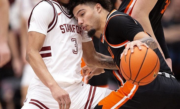 Feb 24, 2024; Stanford, California, USA; Oregon State Beavers guard Jordan Pope (right) collides with Stanford Cardinal guard Kanaan Carlyle (3) during the first half at Maples Pavilion. Mandatory Credit: D. Ross Cameron-USA TODAY Sports