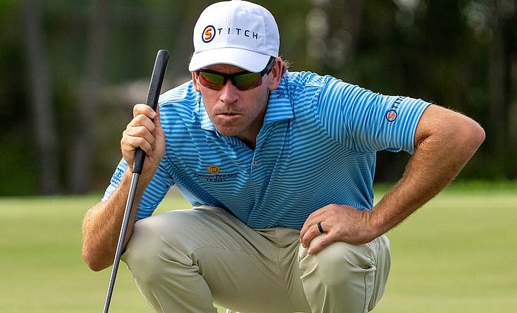January 13, 2024; Honolulu, Hawaii, USA; Ben Kohles lines up his putt on the first hole during the third round of the Sony Open in Hawaii golf tournament at Waialae Country Club. Mandatory Credit: Kyle Terada-USA TODAY Sports