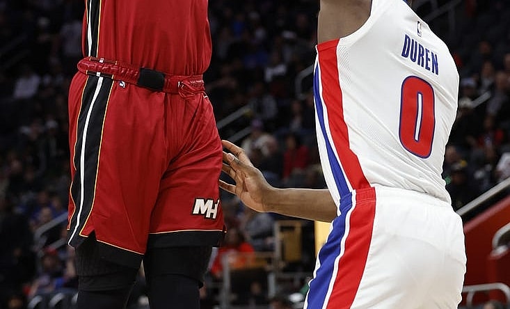 Mar 17, 2024; Detroit, Michigan, USA;  Miami Heat center Bam Adebayo (13) shoots on Detroit Pistons center Jalen Duren (0) in the first half at Little Caesars Arena. Mandatory Credit: Rick Osentoski-USA TODAY Sports
