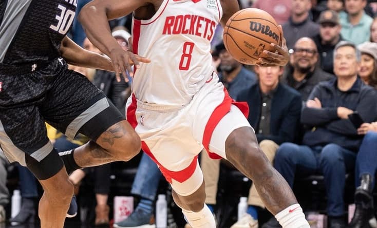 Jan 11, 2023; Sacramento, California, USA; Houston Rockets forward Jae'Sean Tate (8) drives to the basket against Sacramento Kings forward KZ Okpala (30) during the first quarter at Golden 1 Center. Mandatory Credit: Ed Szczepanski-USA TODAY Sports