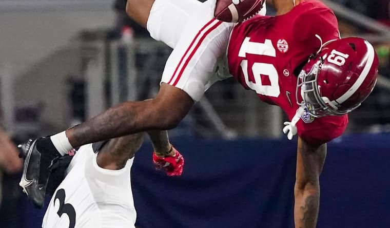 Alabama tight end Jahleel Billingsley (19) is upended by Cincinnati safety Ja'von Hicks (3) in the 2021 College Football Playoff Semifinal game at the 86th Cotton Bowl in AT&T Stadium in Arlington, Texas Friday, Dec. 31, 2021. [Staff Photo/Gary Cosby Jr.]

College Football Playoffs Alabama Vs Cincinnati