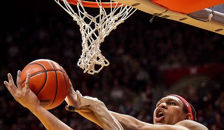 Indiana's Malik Reneau (5) is fouled by Michigan State's Tyson Walker (2) during the first half of the Indiana versus Michigan State men's basketball game at Simon Skjodt Assembly Hall on Sunday, March 10, 2024.