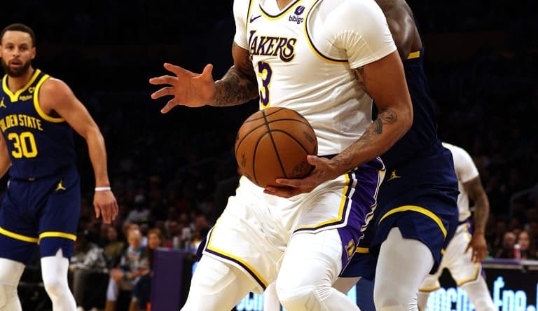 vMar 16, 2024; Los Angeles, California, USA; Los Angeles Lakers forward Anthony Davis (3) spins against Golden State Warriors forward Draymond Green (23) during the first quarter at Crypto.com Arena. Mandatory Credit: Jason Parkhurst-USA TODAY Sports