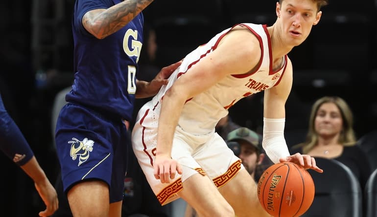 Dec 18, 2021; Phoenix, Arizona, USA; Southern California Trojans guard Drew Peterson (right) controls the ball against Georgia Tech Yellow Jackets guard Michael Devoe during the Colangelo Classic at Footprint Center. Mandatory Credit: Mark J. Rebilas-USA TODAY Sports