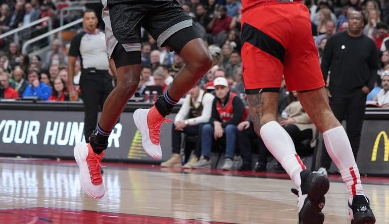 Dec 14, 2022; Toronto, Ontario, CAN; Sacramento Kings guard De'Aaron Fox (5) drives to the basket as Toronto Raptors guard Gary Trent Jr. (33) tries to defend during the second quarter at Scotiabank Arena. Mandatory Credit: Nick Turchiaro-USA TODAY Sports