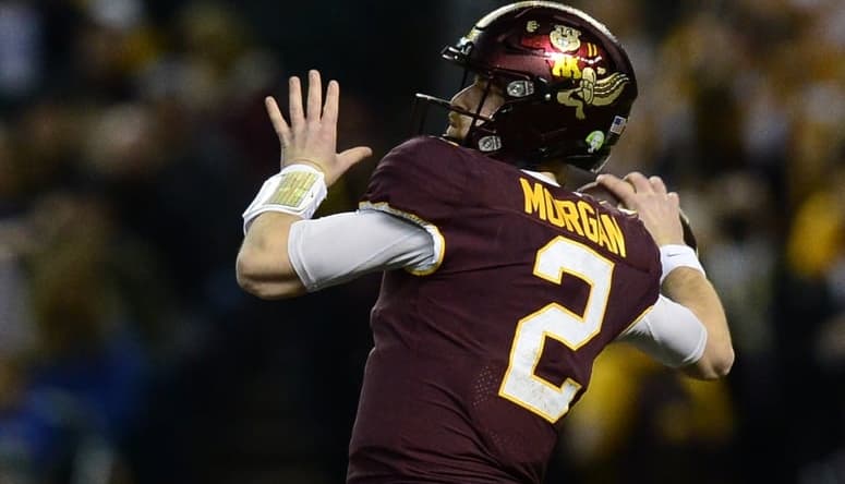 Dec 28, 2021; Phoenix, AZ, USA; Minnesota Golden Gophers quarterback Tanner Morgan (2) throws the ball against the West Virginia Mountaineers during the first half at Chase Field. Mandatory Credit: Joe Camporeale-USA TODAY Sports