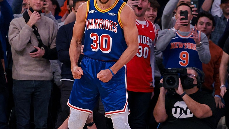 Dec 14, 2021; New York, New York, USA; Golden State Warriors guard Stephen Curry (30) reacts after a three point basket breaking the career record for total three pointers made  during the during the first quarter against the New York Knicks at Madison Square Garden. Mandatory Credit: Vincent Carchietta-USA TODAY Sports