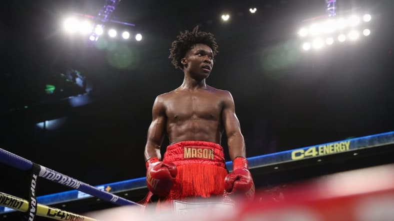 Lightweights Ronal Ron, blue corner, and Abdullah Mason, red corner, fight in a Top Rank bout at the American Bank Center on