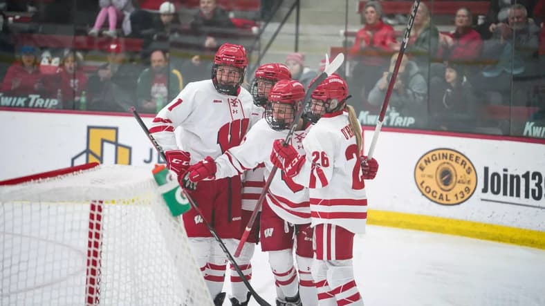 Wisconsin forwards Kirsten Simms and Casey O'Brien celebrate after a goal.