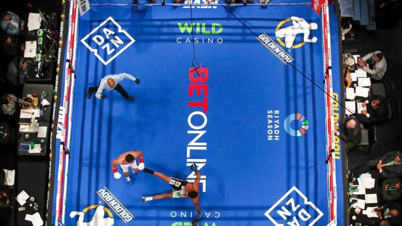 Ruslan Abdullaev of Tashkent, Uzbekistan, earns a knockdown against Eduardo Abreu of Montevideo, Uruguay, during the third round