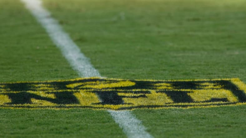 Aug 14, 2015; Jacksonville, FL, USA; A gold-painted NFL logo on the field before the start of a preseason NFL football game between the Pittsburgh Steelers and the Jacksonville Jaguars at EverBank Field. The logo is part of the NFL's "On the Fifty" campaign, to promote Super Bowl 50 next February. The Jacksonville Jaguars won 23-21. Mandatory Credit: Phil Sears-USA TODAY Sports