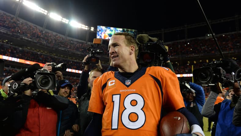 Jan 3, 2016; Denver, CO, USA; Denver Broncos quarterback Peyton Manning (18) celebrates winning following the game against the San Diego Chargers at Sports Authority Field at Mile High. The Broncos defeated the Chargers 27-20. Mandatory Credit: Ron Chenoy-USA TODAY Sports