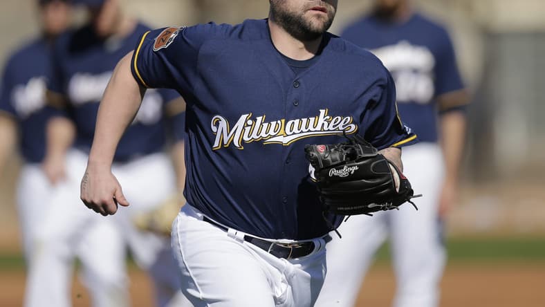Feb 16, 2017; Maryvale, AZ, USA; Milwaukee Brewers relief pitcher Joba Chamberlain (62) covers first base during spring training camp drills at Maryvale Baseball Park. Mandatory Credit: Rick Scuteri-USA TODAY Sports