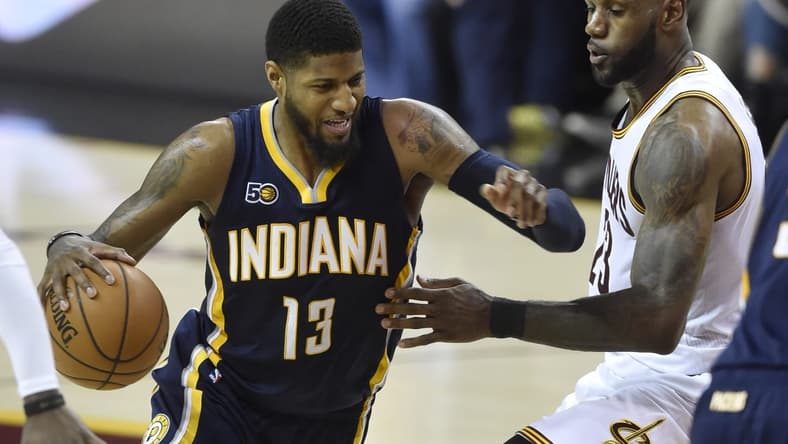 Caption: Apr 2, 2017; Cleveland, OH, USA; Indiana Pacers forward Paul George (13) drives against Cleveland Cavaliers forward LeBron James (23) in the second quarter at Quicken Loans Arena. Mandatory Credit: David Richard-USA TODAY Sports
