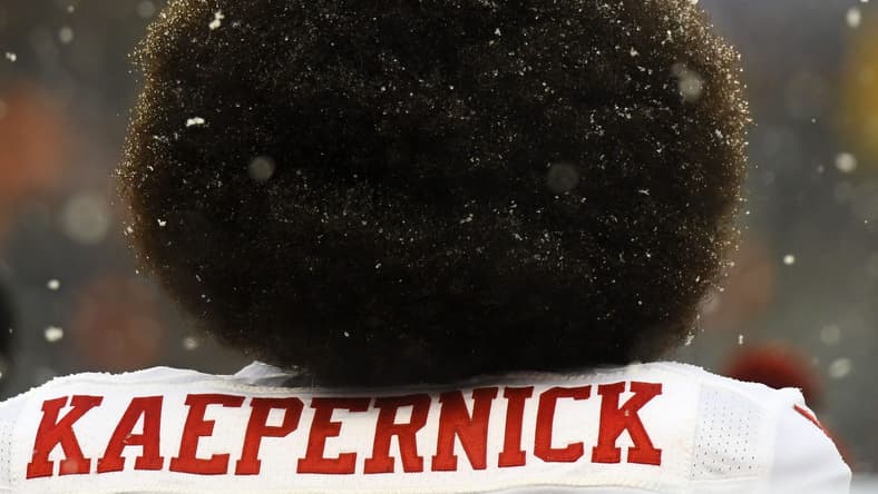 Colin Kaepernick in Chicago as his beautiful hairdo gets snowed upon
