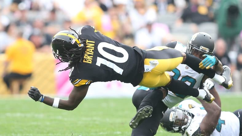 Pittsburgh Steelers wide receiver Martavis Bryant (10) is tackled after a catch by Jacksonville Jaguars cornerback Aaron Colvin (22) during the second quarter at Heinz Field. Jacksonville won 30-9.