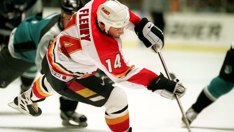 Calgary Flames forward Theoren Fleury shots the pu