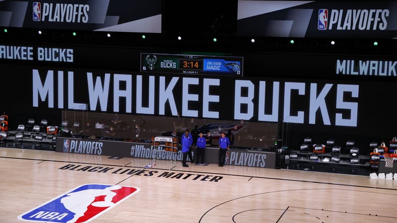 Aug 26, 2020; Lake Buena Vista, Florida, USA; Referees stand on an empty court before the start of a scheduled game between the Milwaukee Bucks and the Orlando Magic for Game Five of the Eastern Conference First Round during the 2020 NBA Playoffs at AdventHealth Arena at ESPN Wide World Of Sports Complex on August 26, 2020 in Lake Buena Vista, Florida. Mandatory Credit: Kevin C. Cox/Pool Photo-USA TODAY Sports