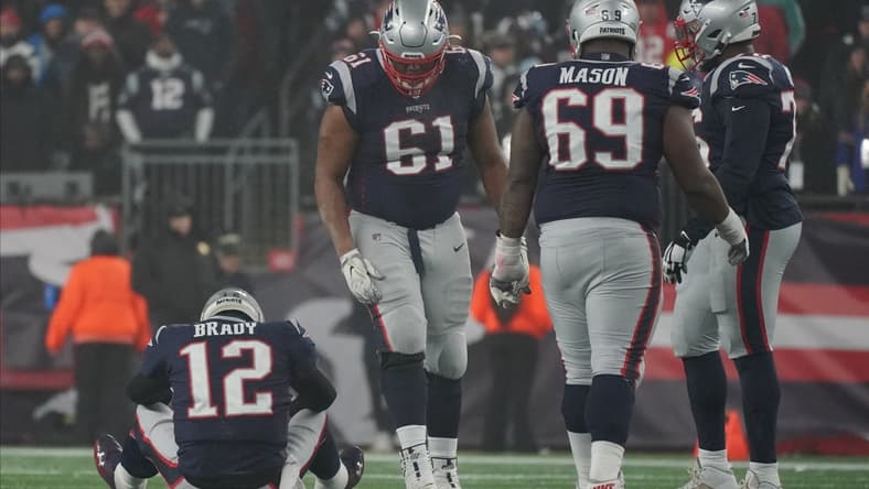 New England Patriots players and QB Tom Brady